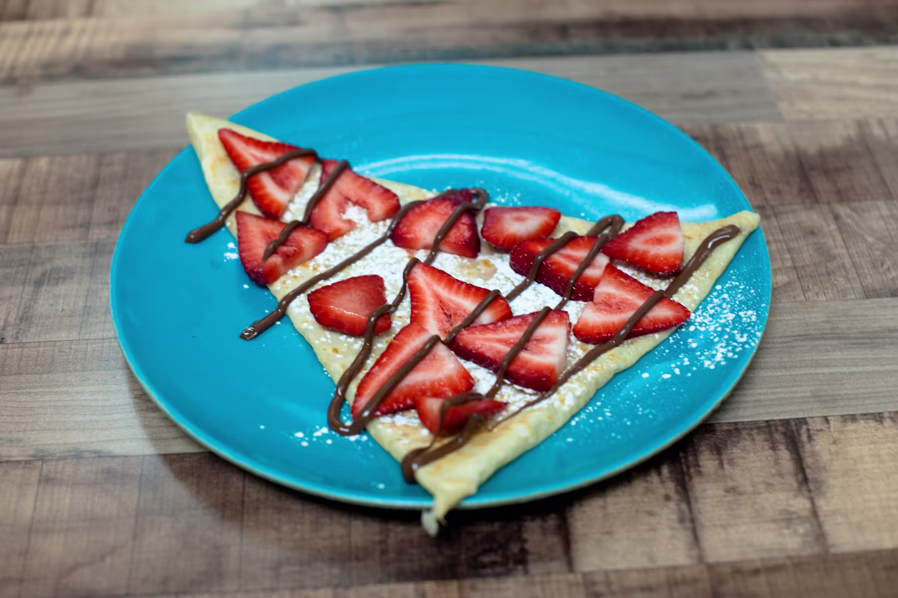 Dessert crepe topped with fresh strawberries